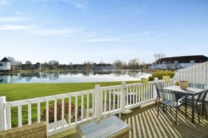 Decking, gardens and a lake view- click for photo gallery